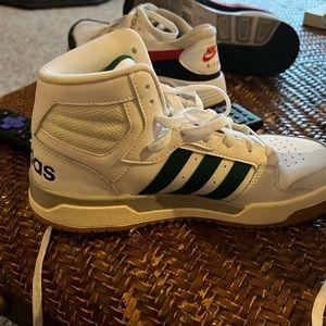Adidas high tops brand new. With green stripe.